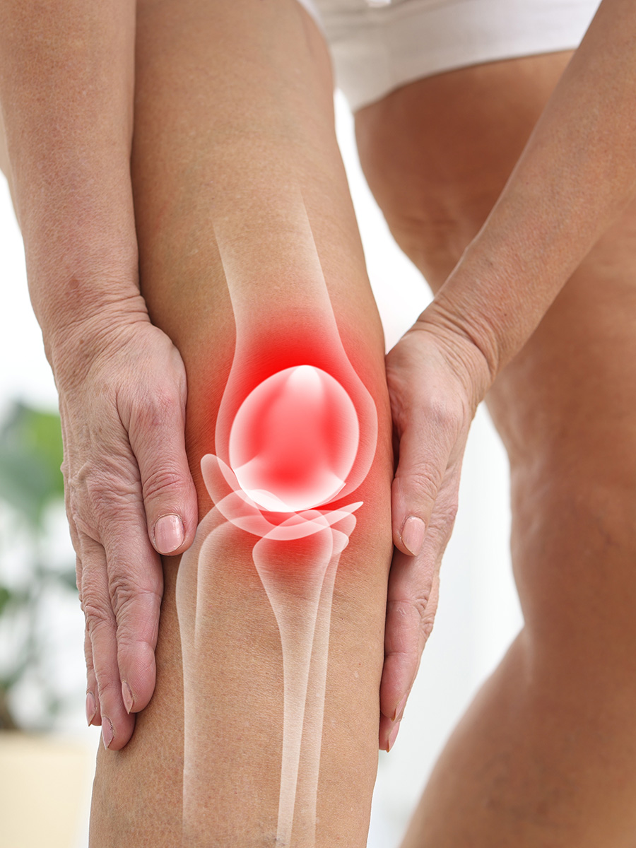 Person holding their knee in pain