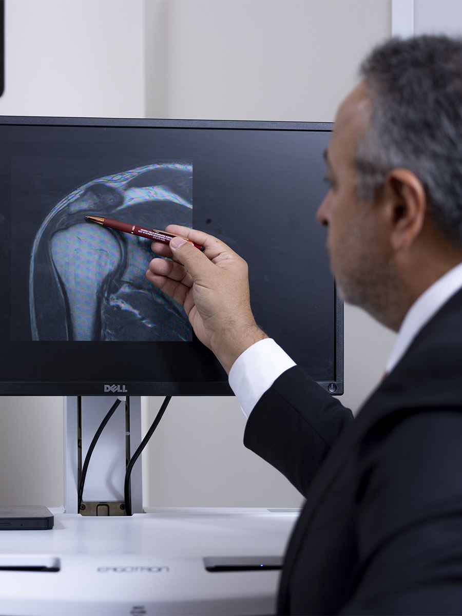 Dr. Kharrazi looking at an x-ray