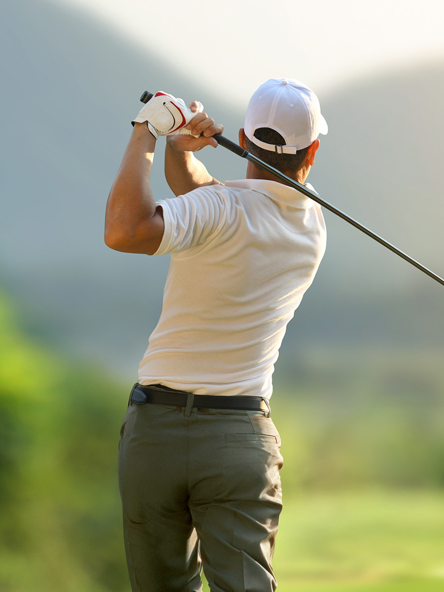A golfer holding his end swing
