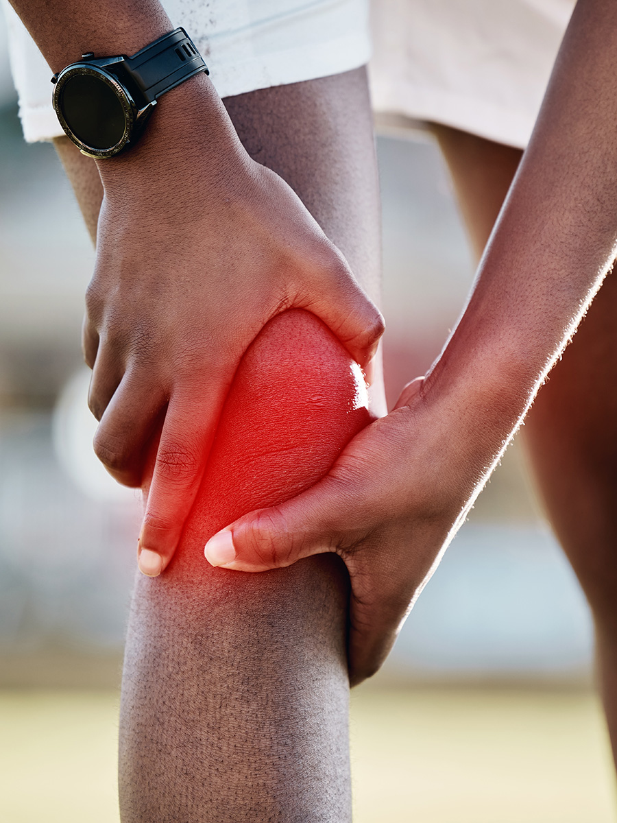 A person holding his knee in pain