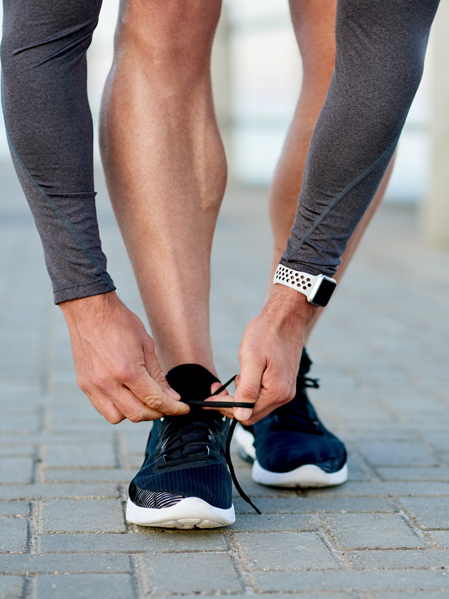 A man tying his shoelaces