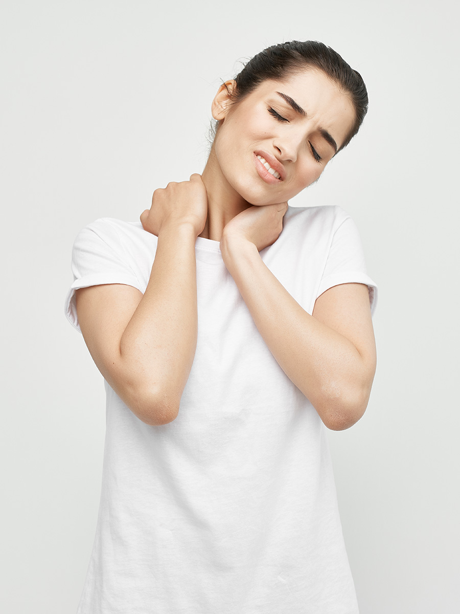 Woman holding her neck in pain