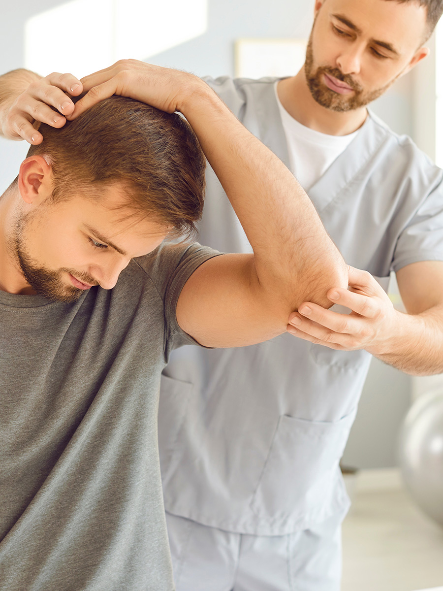 A man getting his elbow examined