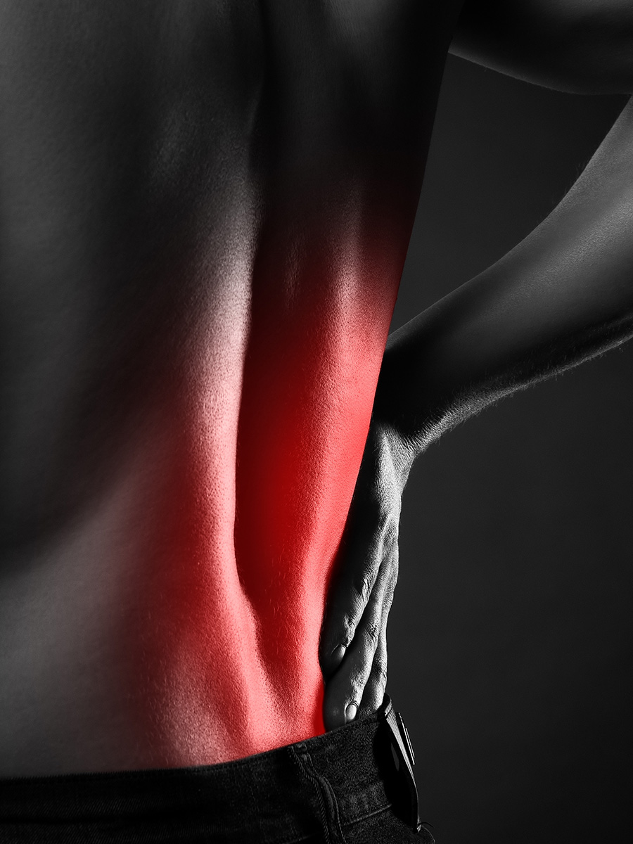 A man holding his back in pain