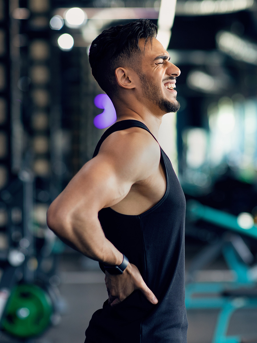 Man at the gym with back pain